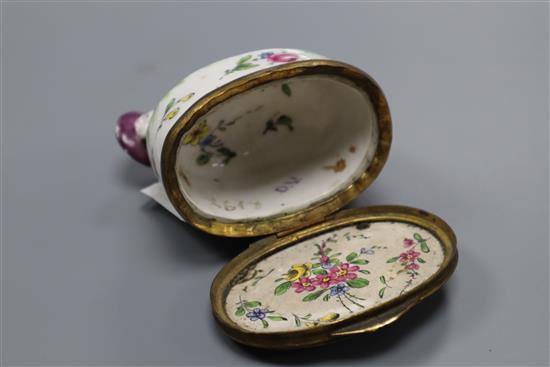 A Continental porcelain snuff box, modelled as a recumbent shepherd, height 6.5cm